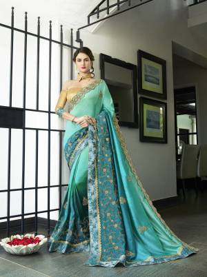 Shades Are Always In , So Grab This Shaded Saree In Shades Of Turquoise Blue Paired With Beige Colored Blouse. This Saree Is Fabricated On Chiffon Silk Paired With Art Silk Fabricated Blouse. This Designer Saree Is Suitable For All Occasion Wear. Buy Now.
