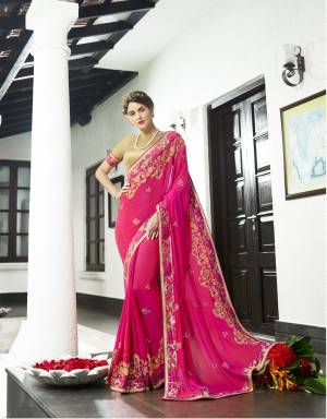 Add A Glam Look Wearing This Designer Saree In Fuschia Pink Color Paired With Beige Colored Blouse. This Saree Is Fabricated On Georgette Paired With Art Silk Fabricated Blouse. It Is Easy To Drape And Carry All Day Long.