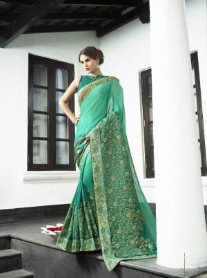 Earn Lots Of Compliments Wearing This Saree In Shade Of Green With Teal Green Colored Saree Paired With Teal Green Colored Blouse. This Saree Is Fabricated On Satin Silk Paired With Art Silk Fabricated Blouse. It Has Attractive Jari Embroidery Which Makes The Saree More Attractive. Buy Now.