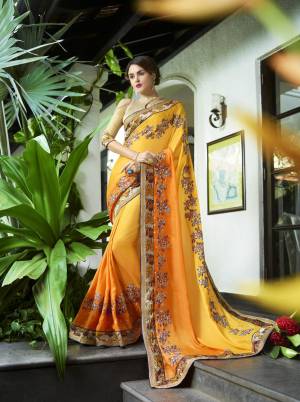 Celebrate This Festive Season Wearing This Saree In Yellow Color Paired With Beige Colored Blouse. This Saree Is Fabricated On Georgette Paired With Art Silk Fabricated Blouse. It Has Contrasting Embroidery Which Earn You Lots Of Compliments From Onlookers.