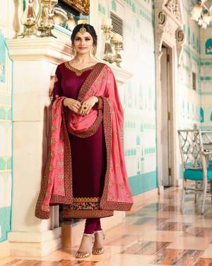 Add This Lovely Shade To Your Wardrobe With This Designer Semi-Stitched Suit In Wine Colored Top Paired With Wine Colored Bottom And Contrasting Pink Colored Dupatta. Its Top Is Fabricated On Soft Silk Paired With Santoon Bottom And Crepe Dupatta. It Has Embroidered Top And Dupatta. Buy This Designer Straight Cut Suit Now.