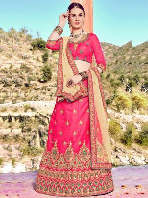 Shine Bright Wearing This Attractive Designer Lehenga Choli In Pink Color Paired With Beige Colored Dupatta. Its Blouse And Lehenga Are Fabricated On Art Silk Paired With Net Fabricated Dupatta. It Is Beautified With Embroidery All Over. Buy This Lovely Lehenga Choli Now.