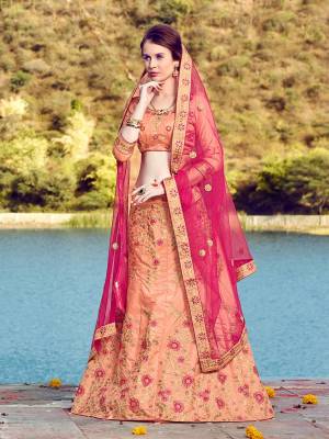 Look Pretty Wearing This Lovely Combination With This Designer Lehenga Choli In Peach Color Paired With Contrasting Dark Pink Colored Dupatta. Its Blouse And Lehenga Are Fabricated On Art Silk Paired With Net Fabricated Dupatta. Buy This Lehenga Choli Now.
