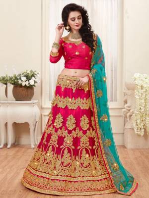 Shine Bright Wearing This Designer Lehenga Choli In Dark Pink Color Paired With Contrasting Turquoise Blue Colored Dupatta. Its Blouse Is Fabricated On Art Silk Paired With Net Fabricated Lehenga And Dupatta. It Is Light Weight And Also Easy To Carry Throughout The Gala.