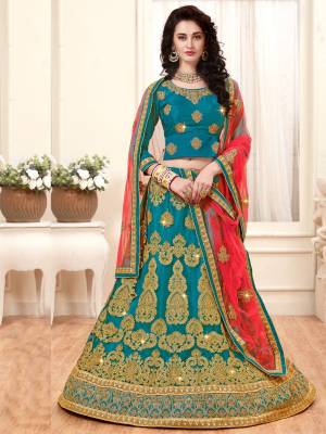 A Very Rare Combination Is Here In Lehenga Choli Is Here With This Designer Lehenga Choli In Turquoise  Blue Color Paired With Contrasting Peach Colored Dupatta. Its Blouse Is Fabricated On Art silk Paired With Net Fabricated Lehenga And Dupatta. Its Fabrics Ensures Superb Comfort All Day Long. Buy Now.