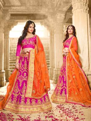 Attract All Wearing This Designer Lehenga Choli In Magenta Pink Color Paired With Contrasting Orange Colored Blouse. Its Blouse Is Fabricated On Art Silk Paired With Net Fabricated Lehenga And Dupatta. This Lehenga Choli Is Light Weight And Easy To Carry All Day Long. Buy Now.