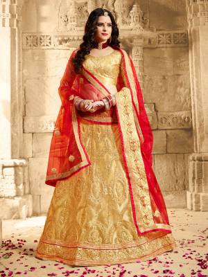 Simple And Elegant Looking Designer Lehenga Choli Is Here In Beige Color Paired With Red Colored Dupatta. Its Blouse Is Fabricated On Art Silk Paierd With Net Fabricated Lehenga And Dupatta. Its Subtle Color And Evergreen Combination Gives Your Personality A Beautiful Look Like Never Before. 
