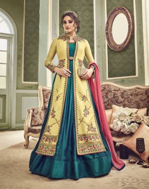 You Will Definitely Earn Lots Of Compliments Wearing This Designer Floor Length Suit In Blue And Yellow Color Paired With Contrasting Pink Colored Dupatta. Its Top And Jacket Are Fabricated On Art Silk Paired With Chiffon Dupatta.  It Has Heavy Embroidered Jacket Which Can Be Paired As Per Your Suitability. Buy This Designer Floor Length Suit Now.