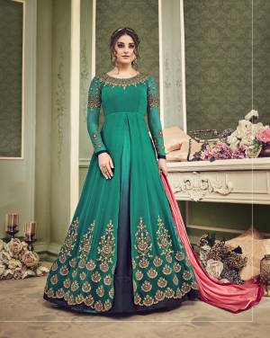 New And Unique Shade Of Green Is Here With This Designer Floor Length Suit In Teal Green And Navy Blue Color Paired With Teal Green Colored Bottom And Contrasting Pink Colored Dupatta. This Beautiful Suit Will Difinitely Earn You Lots Of Compliments From Onlookers. Buy Now.