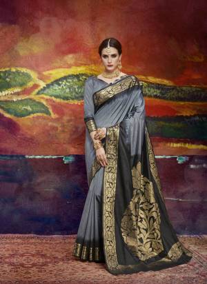 Flaunt Your Rich and Elegant Taste Wearing This Saree In Grey And Black Color Paired With Grey Colored Blouse. This Saree And Blouse are Fabricated On Nylon Art Silk Beautified With Weave. This Rich Looking Saree Will Definitely Earn You Lots Of Compliments From Onlookers.