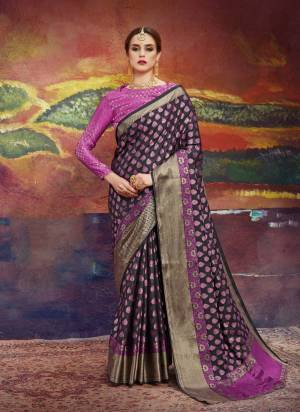 Enhance Your Beauty Wearing This Saree In Black And Magenta Pink Color Paired With Magenta Pink Colored Blouse. This Saree And Blouse Are Fabricated On Nylon Art Silk Beautified With Weave All Over It. Buy This Saree Now.