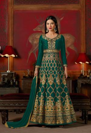 New And Unique Shade In Green Is Here With This Designer Floor Length Suit In Teal Green Color Paired With Teal Green Colored Bottom And Dupatta. Its Top Is Fabricated On Art Silk Paired With Santoon Bottom And Chiffon Dupatta. Get This Semi-Stitched Suit Taillored As Per Your Desired Fit And Comfort.