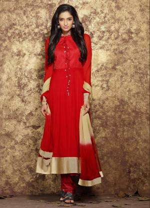 Adorn The Angelic Look Wearing This Suit In Red Color Paired With Red Colored Bottom And Red And Cream Colored Dupatta. Its Top Is Fabricated On Chiffon Paired With Santoon Bottom And Chiffon Dupatta.