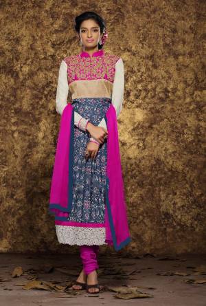 Go Colorful With This Designer Suit In Blue And White Colored Top Paired With Contrasting Magenta Pink Colored Bottom And Dupatta. Its Top Is Fabricated On Art Silk And Modal Paired With Cotton Bottom And Chiffon Dupatta. Buy This Suit Now.