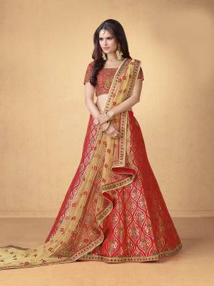 Adorn The Pretty Angelic Look Wearing This Designer Lehenga Choli In Red Color Paired With Beige Colored Dupatta. Its Blouse And Lehenga Are Fabricated On Art Silk Paired With Net Fabricated Dupatta. It Is Beautified With Foil Prints And Jari Work. 