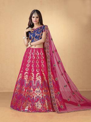 Grab This Beautiful Designer Lehenga Choli In Blue Colored Blouse Paired With Rani Pink Colored Lehenga And Dupatta. Its Blouse And Lehenga Are Fabricated On Art Silk Paired With Net Fabricated Dupatta. Buy It Soon Before The Stock Ends.