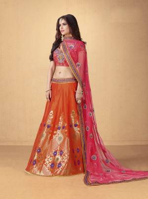 Add Colors To Your Attire This Summer With This Beautiful Lehenga Choli In Pink Colored Blouse Paired With Orange Colored Lehenga And Pink Colored Dupatta. Its Blouse And Lehenga Are Fabricated On Art Silk Paired With Net Fabricated Dupatta. Buy Now.