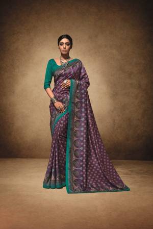Look Beautiful Wearing This Pretty Printed Saree In Purple Color Paired With Contrasting Teal Green Colored Blouse. This Saree Is Fabricated On Tussar Art Silk Paired With Art Silk Fabricated Blouse. This Saree Is Light Weight, Easy To Drape And Carry All Day Long. 