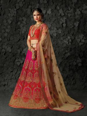 Go Colorful With This Beautiful Designer Heavy Lehenga Choli In Red Colored Blouse Paired With Pink Colored Lehenga And Beige Colored Dupatta. Its Blouse And Lehenga Are Fabricated On Art Silk Paired With Net Fabricated Dupatta. Its Heavy Embroidery And Soft Fabric Will Earn You Lots Of Compliments From Onlookers.