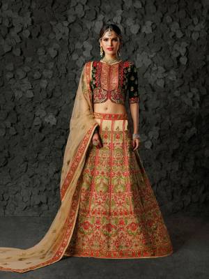 You Will Definitely Earn Lots Of Compliments From Onlookers Wearing This Heavy Designer Lehenga Choli In Dark Green Colored Blouse Paired With Beige Colored Lehenga And Dupatta. Its Blouse Is Fabricated On Velvet Paired With Art Silk Lehenga And Net Dupatta. It Is Also Beautified With Heavy Embroidery All Over It. 