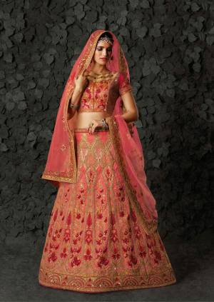 Look Pretty And Earn Lots Of Compliments Wearing This Heavy Designer Lehenga Choli In Dark Pink Colored Blouse Paired With Pink Colored Lehenga And Dupatta. Its Blouse And Lehenga Are Fabricated On Art Silk Paired With Net Fabricated Dupatta. It Is Beautified With Heavy Embroidery All Over It.