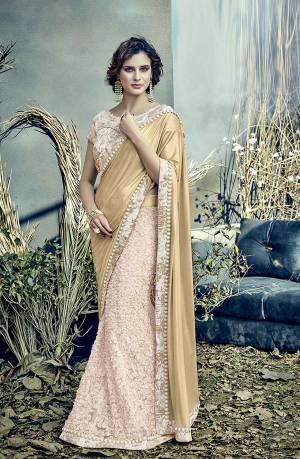 Be regal . Be feminine. Let this be your mantra this spring summer. Adorn this gorgous Golden And Cream Colored saree bedeck with golden sprinkles and flowers and look like a dream. 