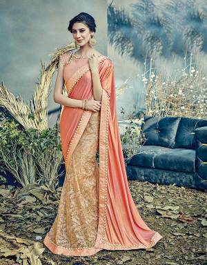 Look nothing short of remarkable in this gorgeous peach saree , a color that'll merge well with all your summery expectations. 