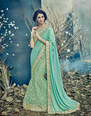 Celebrate summer style with a perfect ethnic touch in this gorgeous aqua hued lehenga saree. Pair with delicate baubles to accentuate the look.