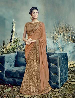 Look like an epitome of sheer granduer and summery elegance in this earthy Brown Color  , flower ornamented lehenga saree . 