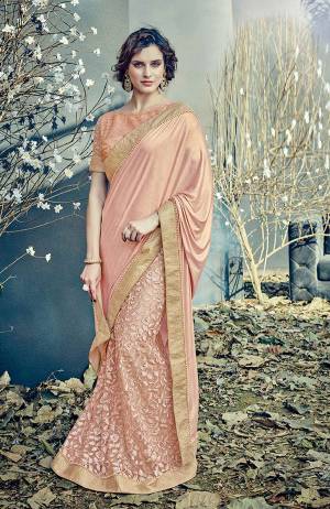 Understated elegance transcends this season and this pastel pink saree lehenga is a perfect pick. Go glam with nude makeup and rose gold jewels . 
