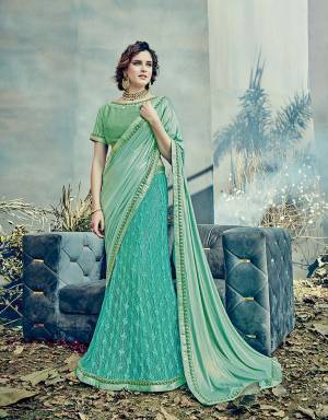 Look promisingly beautiful and fresh as the ocean in this stunning Aqua Blue Colored  lehenga saree. Let the drape fall loose to add to the charm.