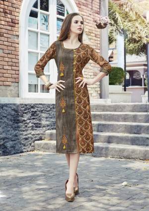 Here Is A Rich And Elegant Looking Readymade Kurti In Grey And Brown Color Fabricated On Cotton Beautified With Prints And Thread Work. It Is Available In Many Sizes. Buy Now.