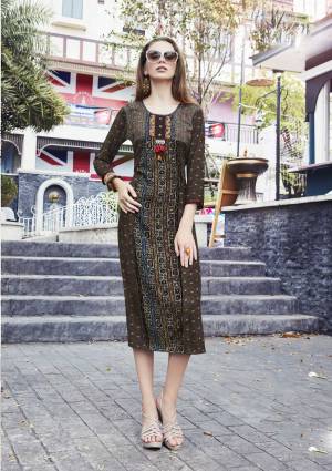 Enhance Your Beauty Wearing This Readymade Kurti In Dark Brown Color Fabricated On Cotton Beautified With Prints And Thread Work. This Ready Made Kurti Is Available In Many Sizes. Buy It Now.