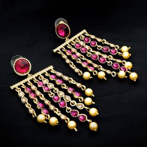 For That Lovely Pink Dress, Grab This Pretty set Of Earrings In golden Color Beautified With Pink Stone Work. Pair This Up With Your Pink Or Any Contrasting Colored Traditonal Attire.