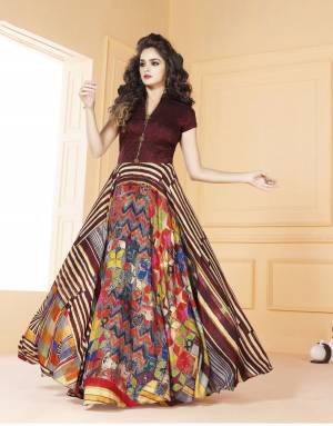 Attract All Wearing This Designer Readymade Gown In Maroon And Multi Color Fabricated On Tussar Art Silk Beautified with Digital Prints. It Is Beautified With Abstract Prints And Available In Many Sizes. Buy Now.