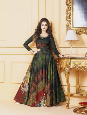 Enhance Your Beauty In Dark Shades Wearing This Designer Gown In Dark Green Color Fabricated On Tussar Art Silk Beautified With Digital Prints All Over It. This Readymade Gown Is Available In Many Sizes. Buy Now.