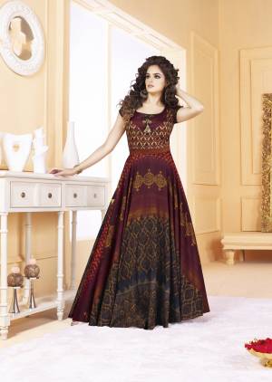 A Must Have Color In Womens Wardrobe Is Here With This Designer Readymade Gown In Wine Color Fabricated On Tussar Art Silk Beautified With Digital Prints All Over It. This Gown Is Light Weight And Easy To Carry All Day Long.