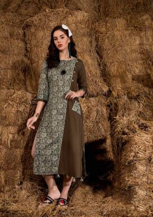 Grab This Pretty Kurti In Brown And Grey Color Fabriacted On On Rayon Cotton Beautified with Prints And Pattern. This Pretty Kurti Will Definitely Earn You Lots Of Compliments From Onlookers.