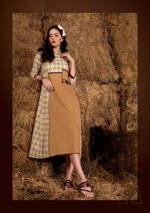 Simple And Elegant Looking Readymade Kurti Is Here In Beige Color Fabricated On Rayon Cotton Beautified With Prints All Over. This Kurti Is Light In Weight And Easy To Carry All Day Long.