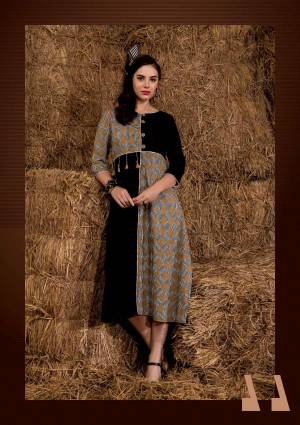 Add This Pretty Simple And Elegant Looking Readymade Kurti To Your Wardrobe In Black And Beige Color Fabricated On Rayon Cotton Beautified With Prints All Over. This Kurti Is Light Weight And Easy To Carry All Day Long.