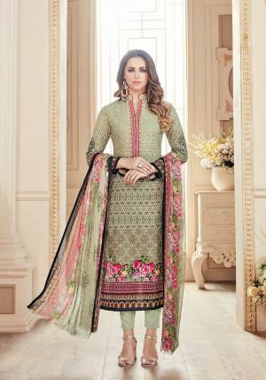 Flaunt Your Rich And Elegant Taste Wearing This Suit In Cream Colored Top Paired With Pastel Green Colored Bottom And Multi Colored Dupatta. Its Top And Bottom Are Fabricated On Cotton Paired With Chiffon Dupatta. It Is Beautified With Digital Prints And Thread Work.