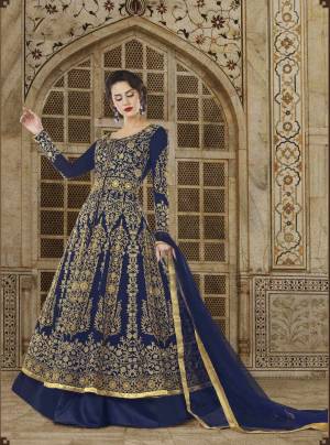 Enhance Your Personality Wearing This Beautiful Indo-Western Suit In Dark Blue Color Paired With Dark Blue Colored Lehenga, Golden Colored Pants And Dark Blue Colored Dupatta. You Can Use Both Its Bottom Fabrics as Per Your Desire Into Blue Or Golden. Its Top, Bottom And Lehenga Are Fabriacated On Art Silk Paired With Net Fabricated Dupatta. Buy Now.