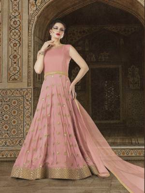 Look The Most Prettiest Of All Wearing This Designer Floor Length Suit In Baby Pink Color Paired With Baby Pink Colored Bottom, Dupatta And Cape. Its Top IS Fabricated On Soft Art Silk Paired With Santoon Bottom And Net Fabricated Dupatta And Cape. Grab This Designer Piece Now.
