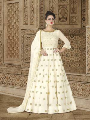 Simple And Elegant Looking Designer Floor Length Suit Is Here In Off-White Colored Top Paired With Off-White Colored Bottom And Dupatta. Its Top Is Fabricated On Georgette Paired With Santoon Bottom And Georgette Dupatta. Buy Now.