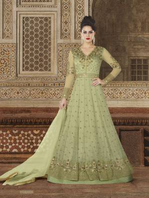 A Very Pretty Shade In Green Is Here With This Designer Floor Length Suit In Mint Green Color Paired With Mint Green Colored Bottom And Dupatta. Its Top Is Fabricated On Net Paired With Santoon Bottom And Net Dupatta. This Color And Detailed Embroidery Will Earn You Lots Of Compliments From Onlookers.