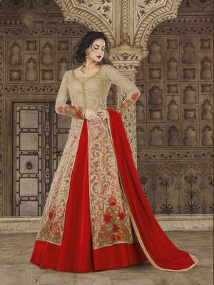 Here IS Another Designer Indo-Western Suit In Beige Colored Top Paired With Red Colored Lehenga And Dupatta. Its Top Is Fabricated On Net Paired With Art Silk Lehenga And Chiffon Dupatta. It IS Light Weight And Easy To Carry All Day Long.