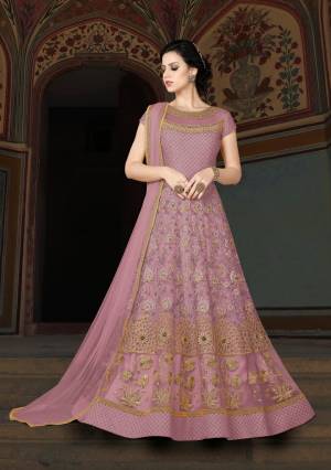 Flaunt Your Rich And Elegant Taste Wearing This Designer Floor Length Suit In Lavendor Color Paired With Lavendor Colored Bottom And Dupatta. Its Top Is Fabricated On Net Paired With Santoon Bottom And Chiffon Dupatta. Its Beautiful Yoke Pattern Will Earn You Lots Of Compliments From Onlookers.