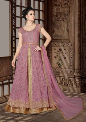 Look Pretty In This Pretty Pink Colored Designer Floor Length Suit. Its Top Is In Pastel Brown Color Paired With Beige colored Lehenga And Pastel Brown Colored Dupatta. Its Top Is Fabricated On Net Paired With Brocade Lehenga And Net Dupatta. Buy This Indo-Western Suit Now.