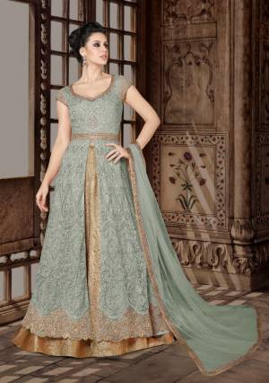 Look Pretty In This Laurel Green Colored Designer Floor Length Suit. Its Top Is In  Laurel Green  Color Paired With Beige colored Lehenga And  Laurel Green  Colored Dupatta. Its Top Is Fabricated On Net Paired With Brocade Lehenga And Net Dupatta. Buy This Indo-Western Suit Now.