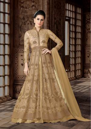 Bright And Visually Appealing Indo-Western Suit Is Here In Beige Color Paired With Golden Colored Lehenga And Beige Colored Dupatta. Its Top Is fabricated On Net Paired With Art Silk Lehenga And Net Dupatta. This Floor Length Suit Is Suitable For All Occasion. Buy This Now.
